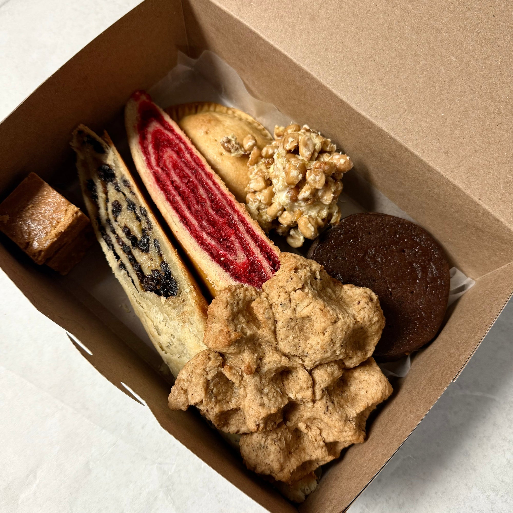 Assorted Grenadian Treat in cardboard box.