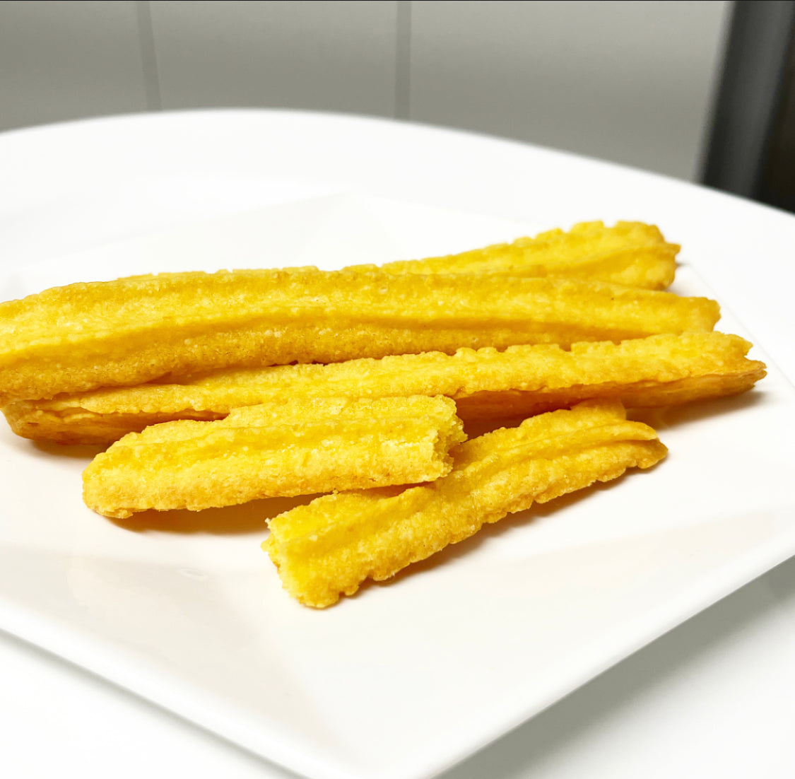 Grenadian cheese straws on plate